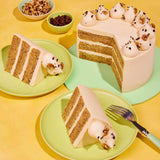 Classic Coffee & Walnut Cake with three layers, Swiss Meringue icing, walnuts, coffee, and piped decoration by Crumbs & Doilies.